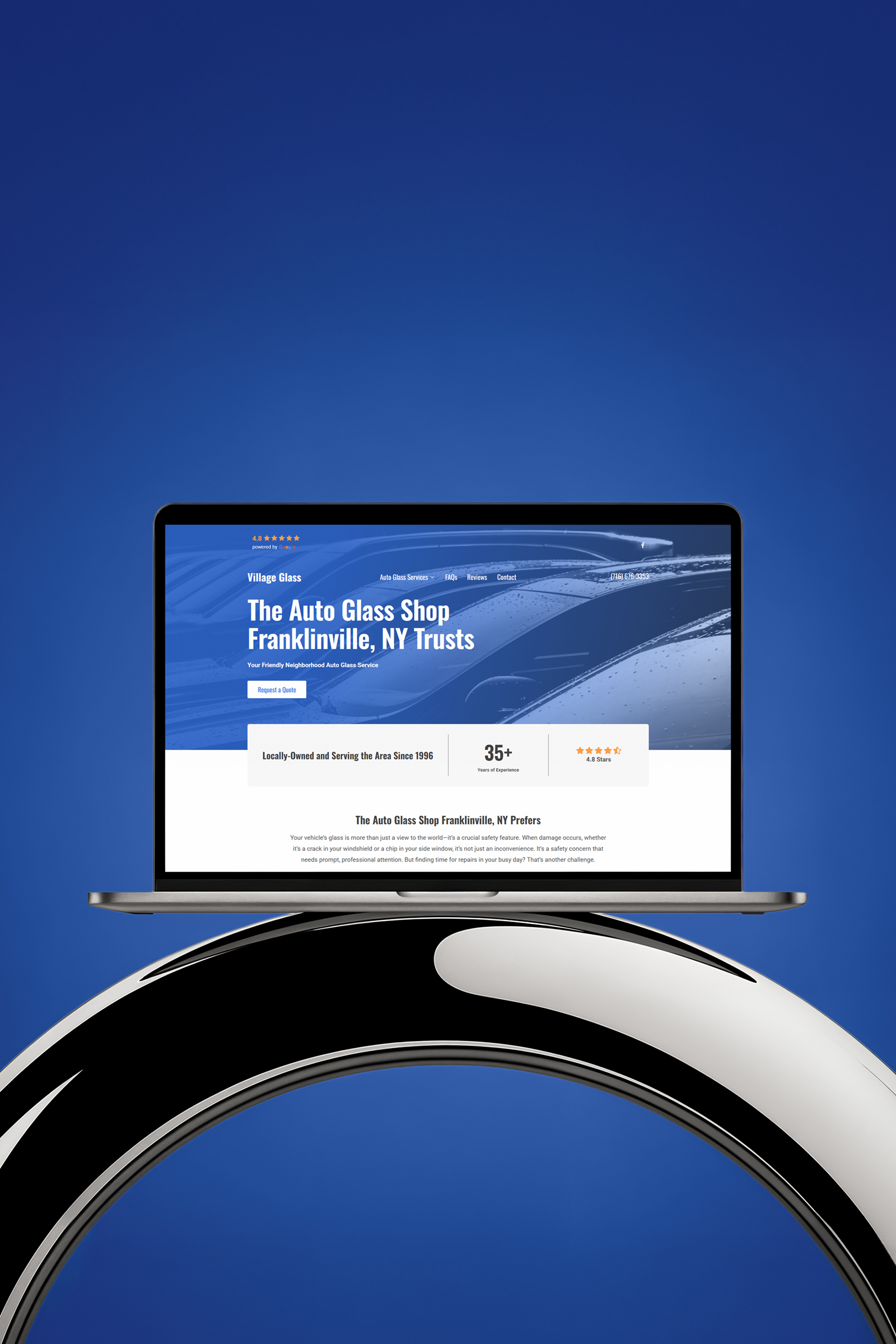 Village Glass website design on a laptop screen